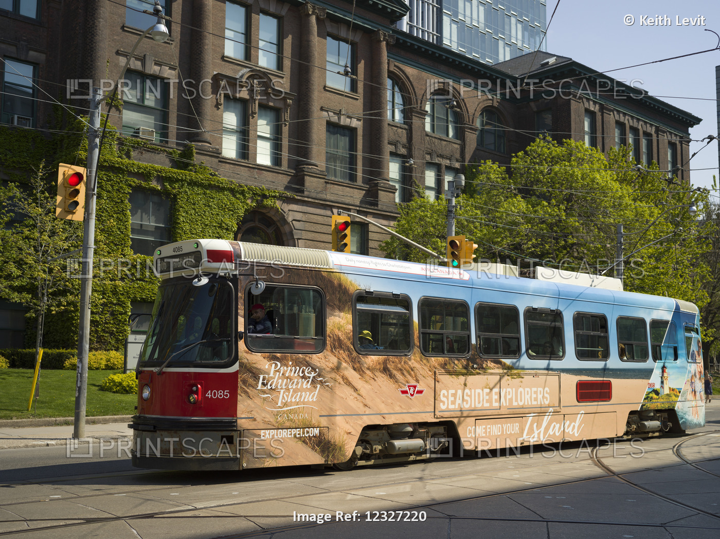 A Toronto Transit System Bus Traveling Down A  Street; Toronto, Ontario, Canada