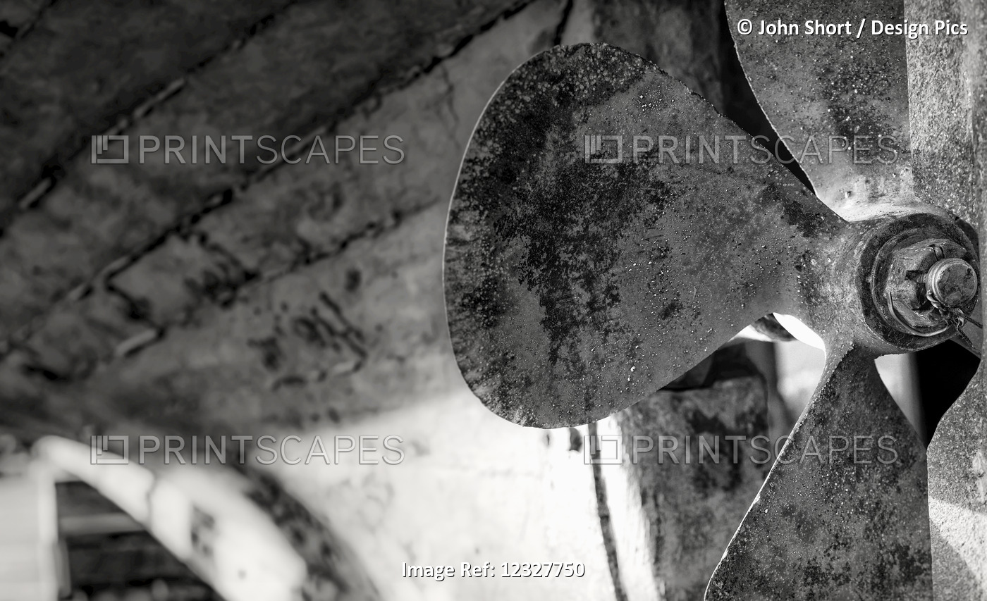 Close-Up Black And White Image Of The Blades Of A Boat's Rusted Propeller; ...