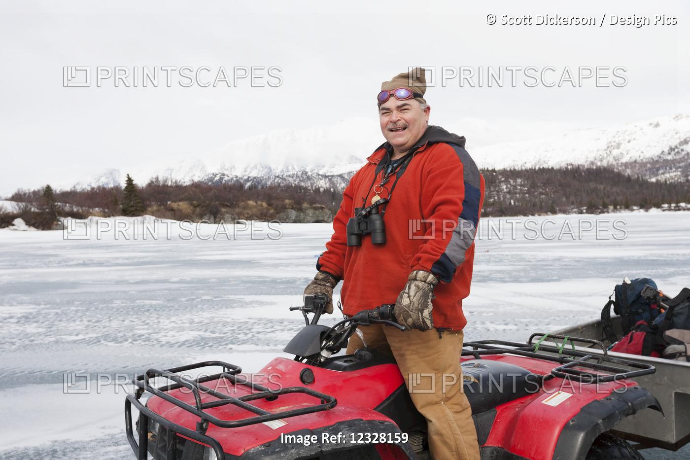 Man On An Atv On A Frozen Lake Iliamna, Pedro Bay, Southcentral Alaska, USA