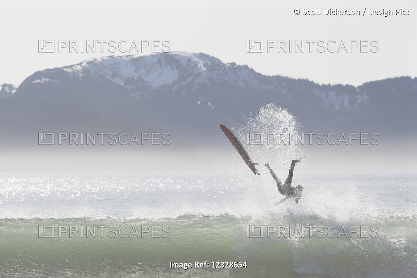 Surfer wipes out on a wave along the Kenai Peninsula Outer Coast, South-central ...