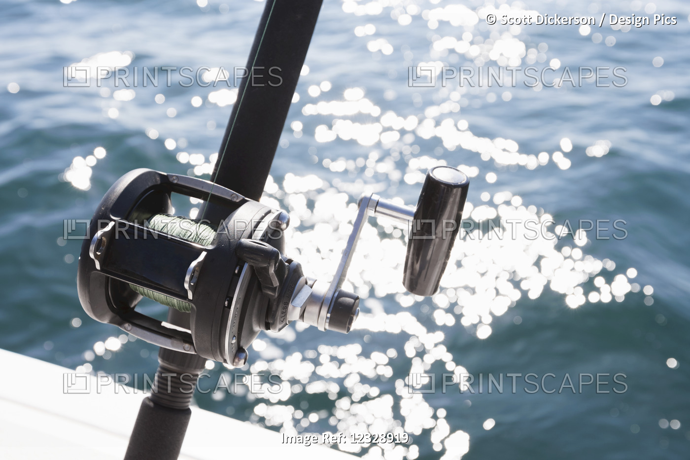 Close-Up Of The Reel On A Fishing Rod And Sparkling Water From The Sunlight; ...