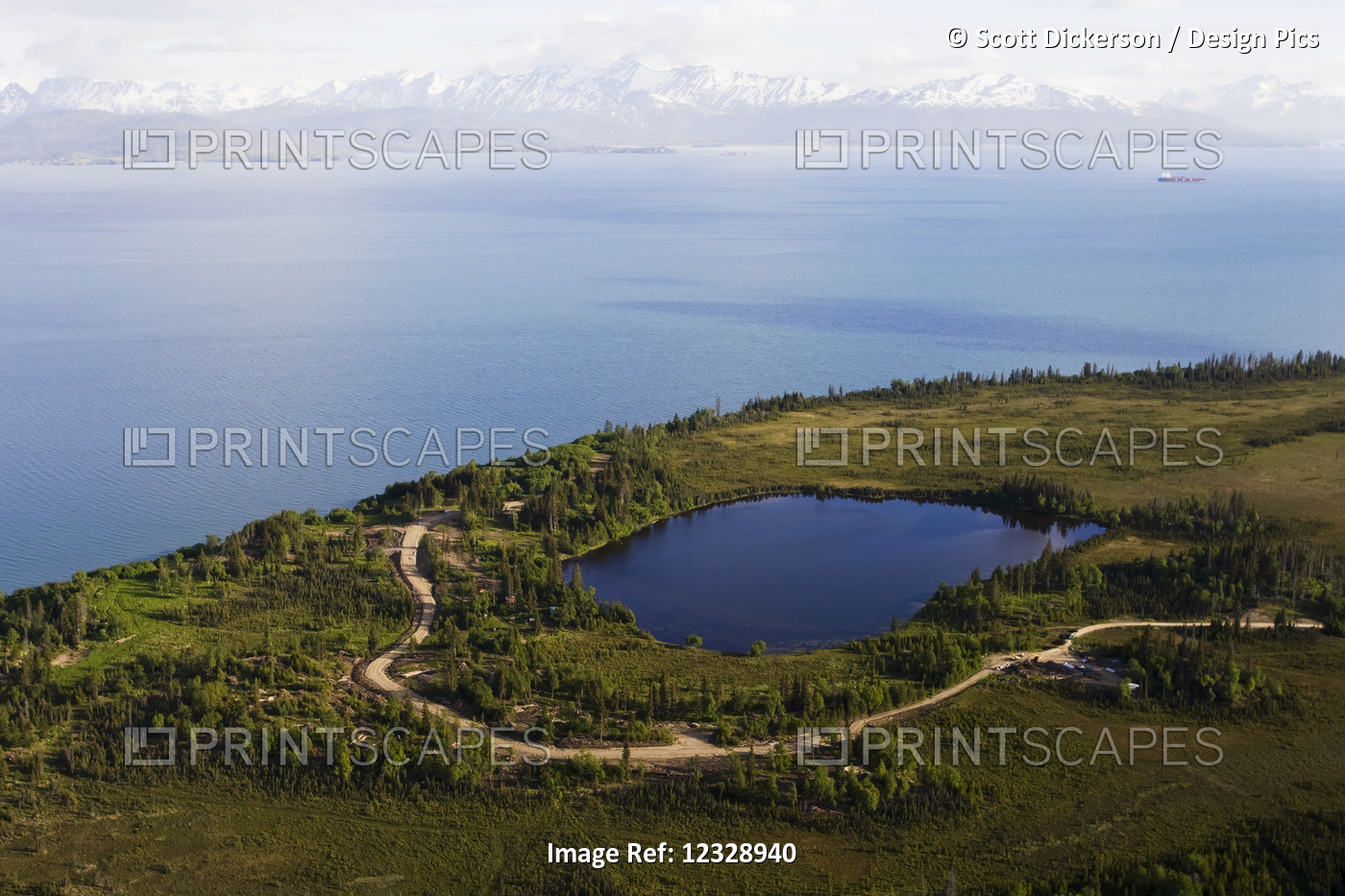 A Lake And Winding Road Off Kachemak Bay With A View Of The Kenai Mountains, ...