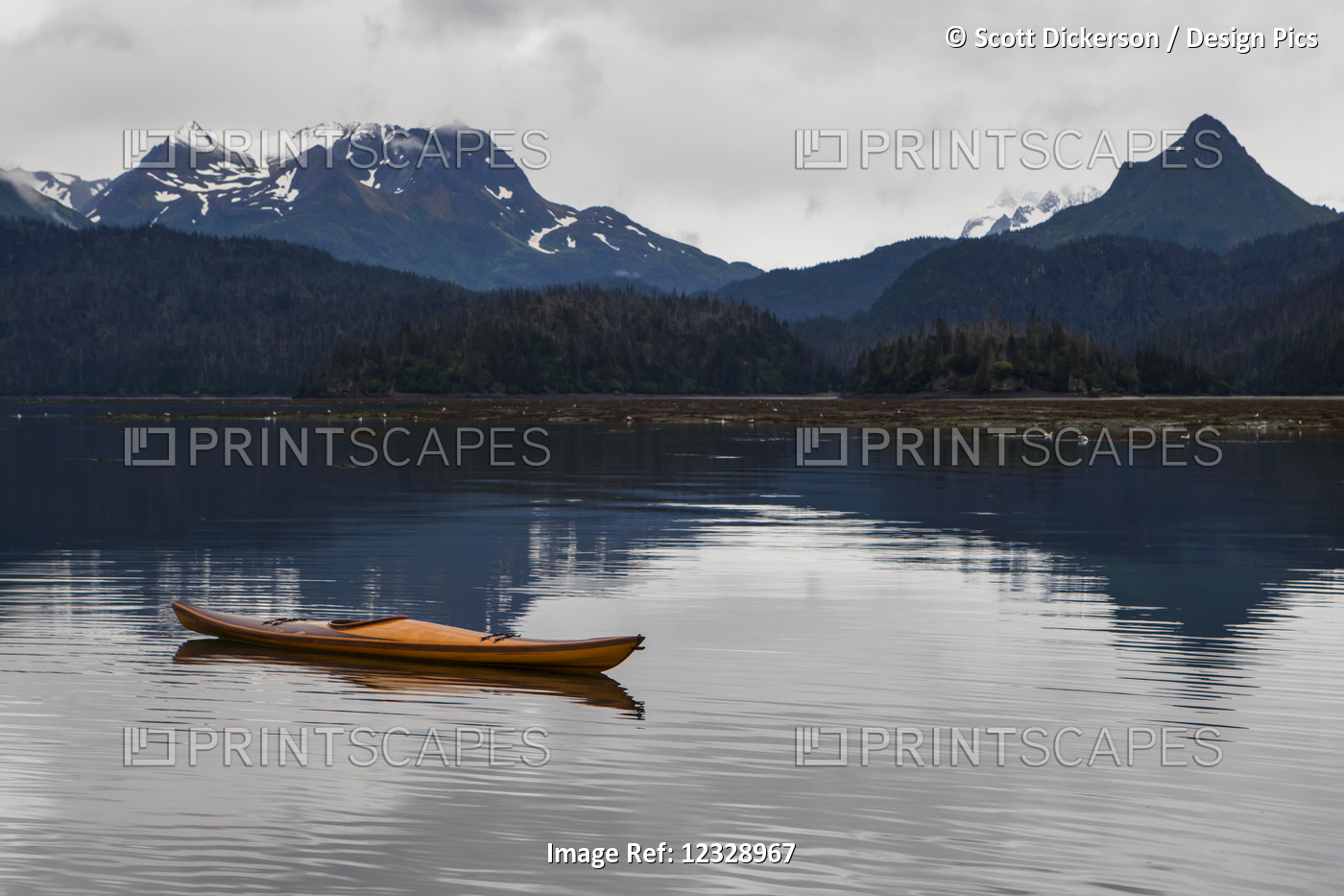 A Kayak Sits On The Tranquil Water With A View Of Forests And A Mountain Range ...