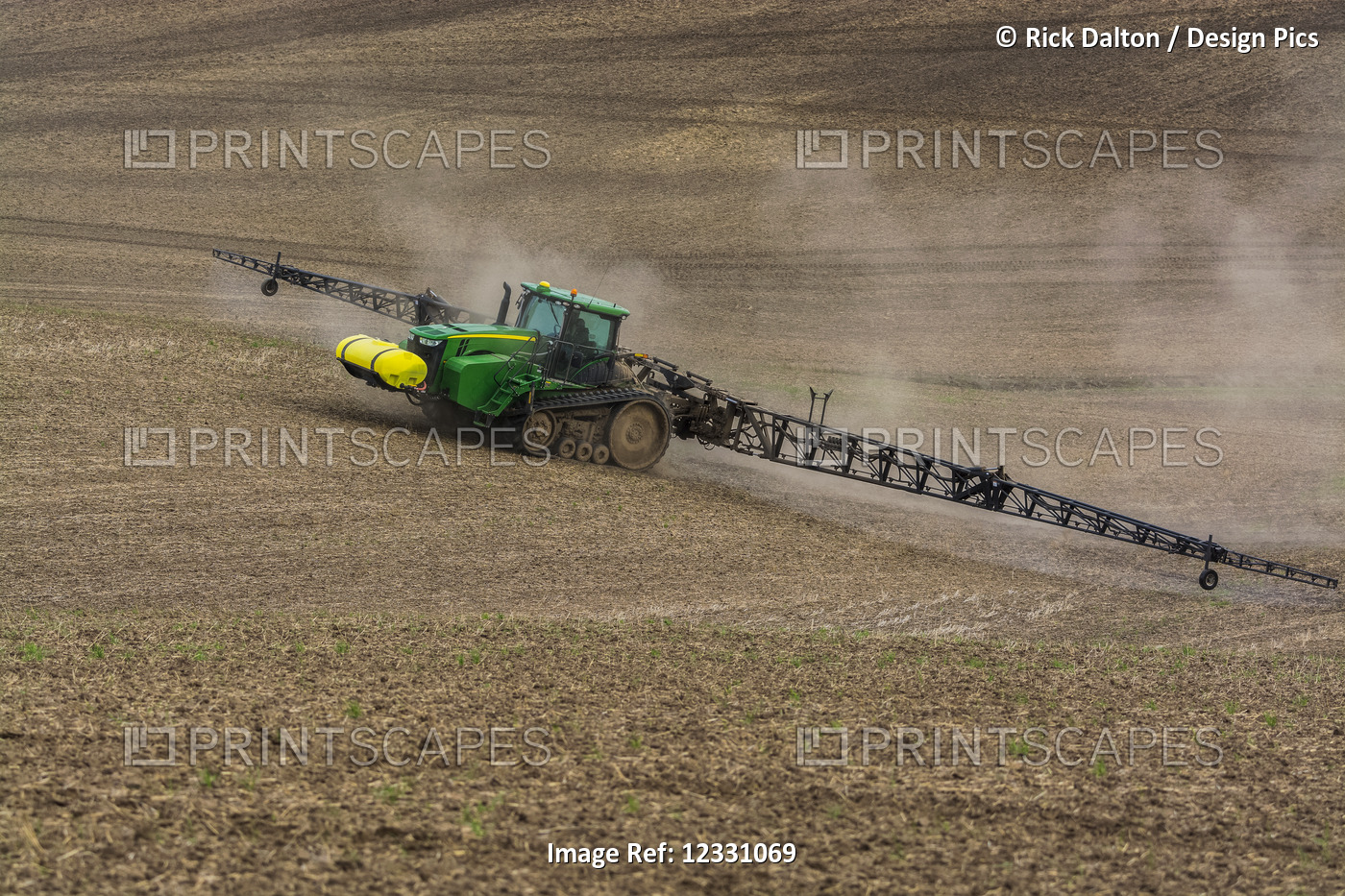 Track Tractor Configured With Spraying Booms Spraying Fertilizer On A Garbanzo ...