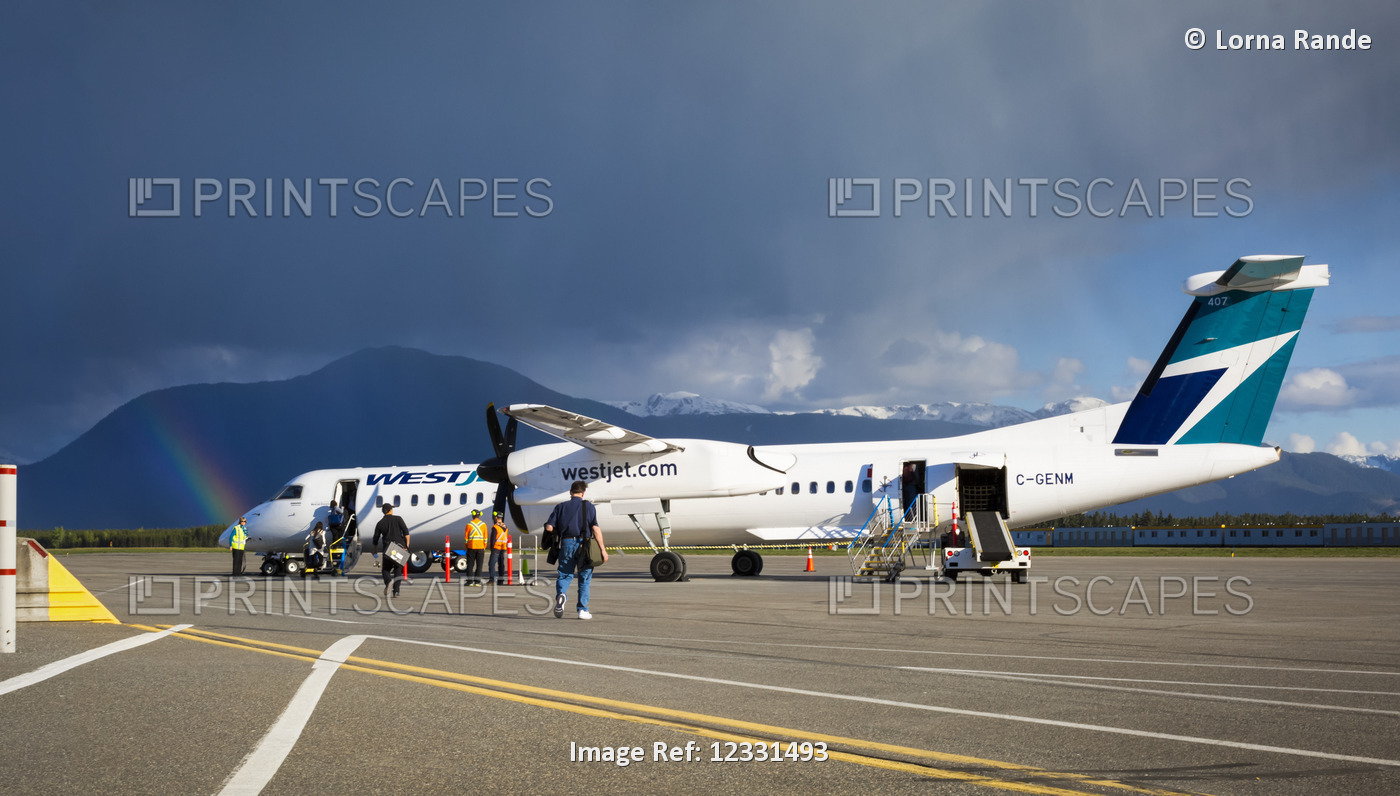 Rainbow Over The Terrace Kitimat Airport As Passengers Load A Plane On The ...