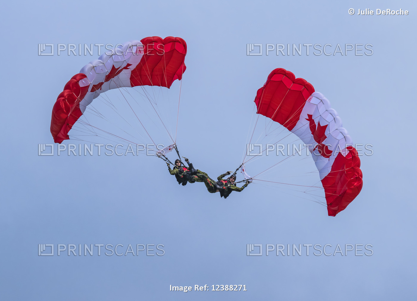 Members of the Sky Hawks flying with Canadian flag parachutes for the 150th ...
