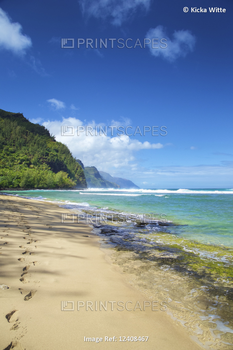 Footprints in the sand along the water's edge on the coastline of the Island of ...