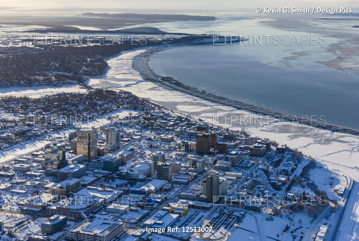 Aerial view of snow covering downtown Anchorage and Cook Inlet at low tide, the ...