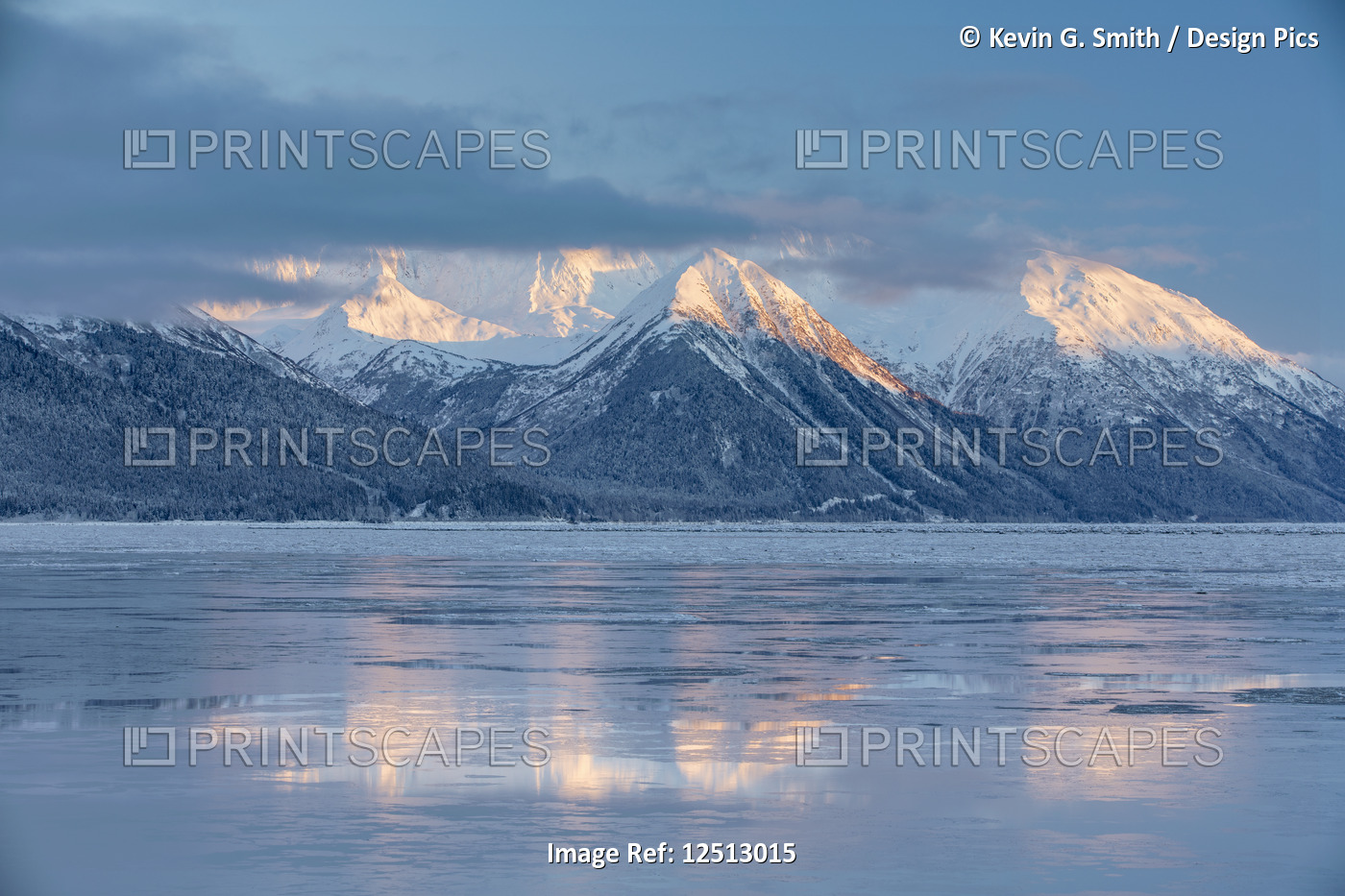 The warm light of sunset lights up the snow-covered peaks of Turnagain Pass, ...