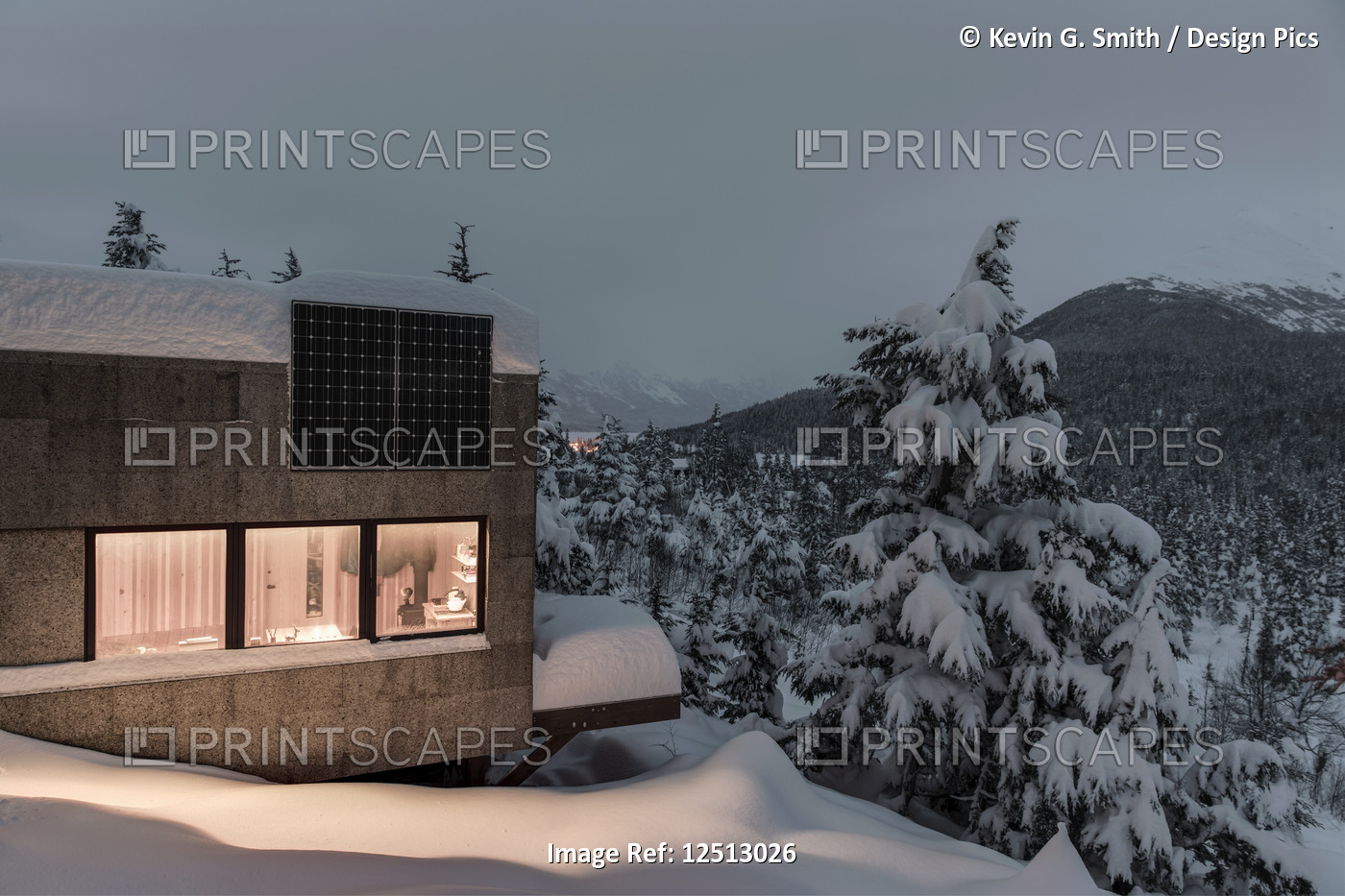 Warm light emanates from a cabin in a snow-covered landscape, solar panels on ...