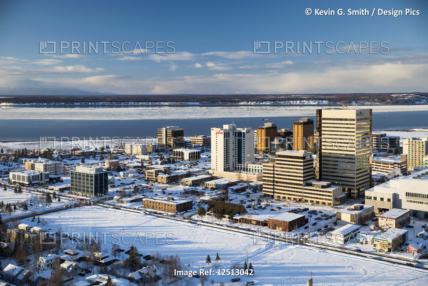 Aerial view of the snow covered park strip and buildings of downtown Anchorage ...