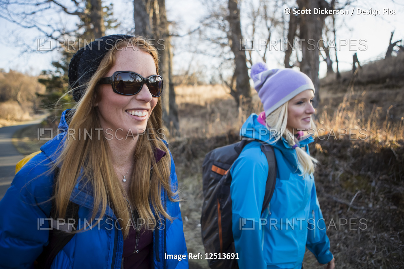 Two young women on a hike on a trail; Anchorage, Alaska, United States of ...