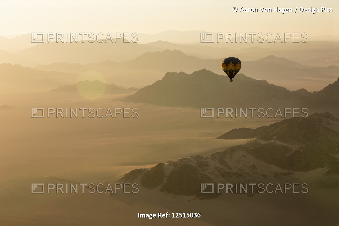 Hot air balloon ride over the sand dunes in the Namib Desert at sunrise; ...