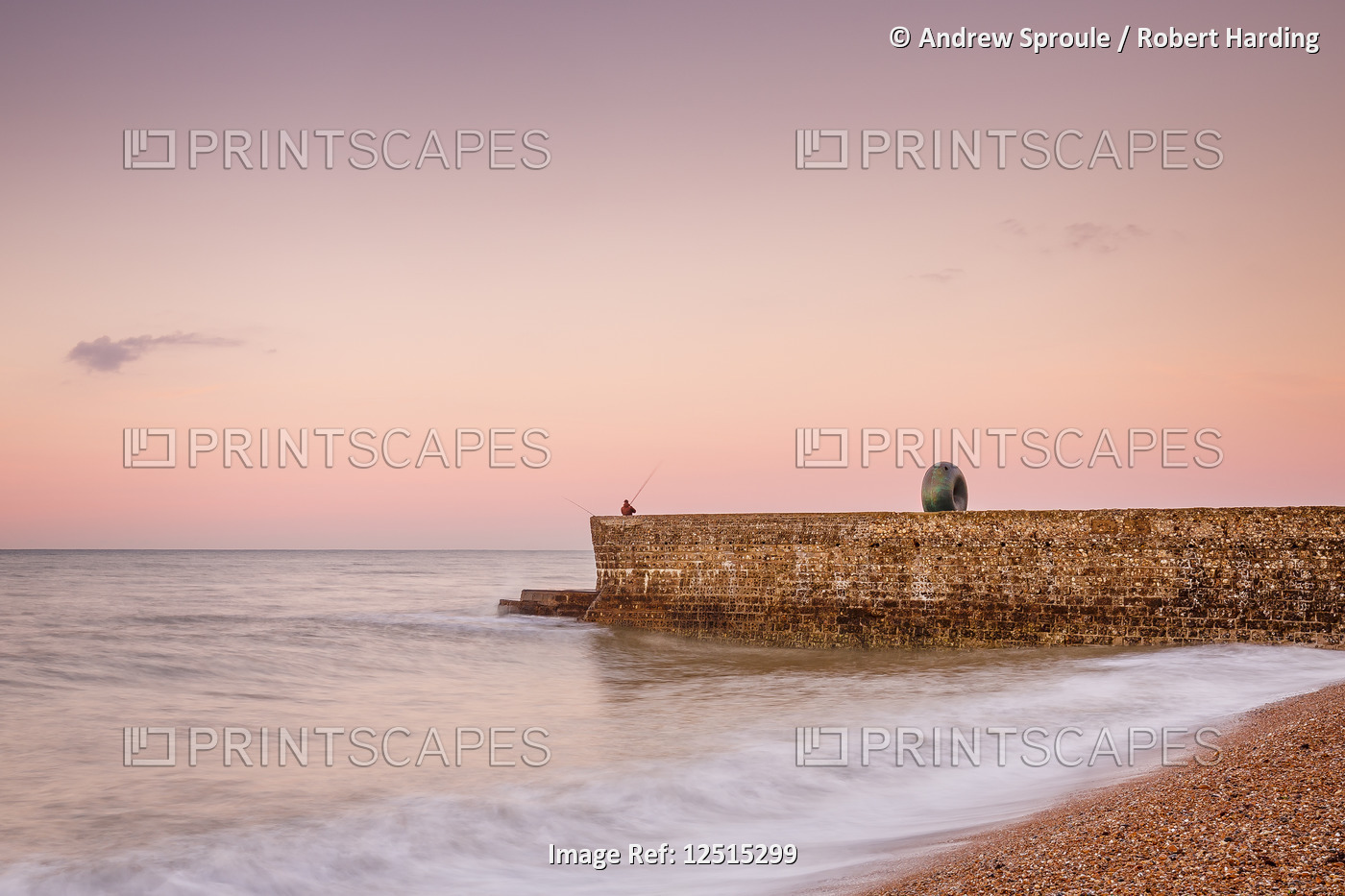 Fisherman and the Green Doughnut sculpture at dawn on Brighton Seafront, Brighton, East Sussex, Engl