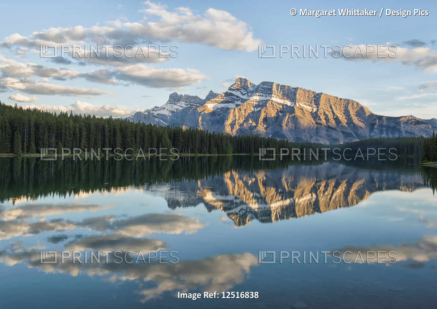 View of the back of Mount Rundle reflected in the water of Two Jack Lake, Banff ...