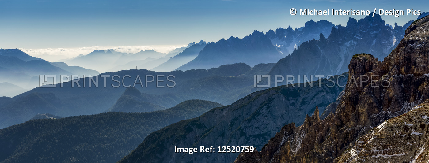 Panorama of silhouetted rugged mountain range; Sesto, Bolzano, Italy