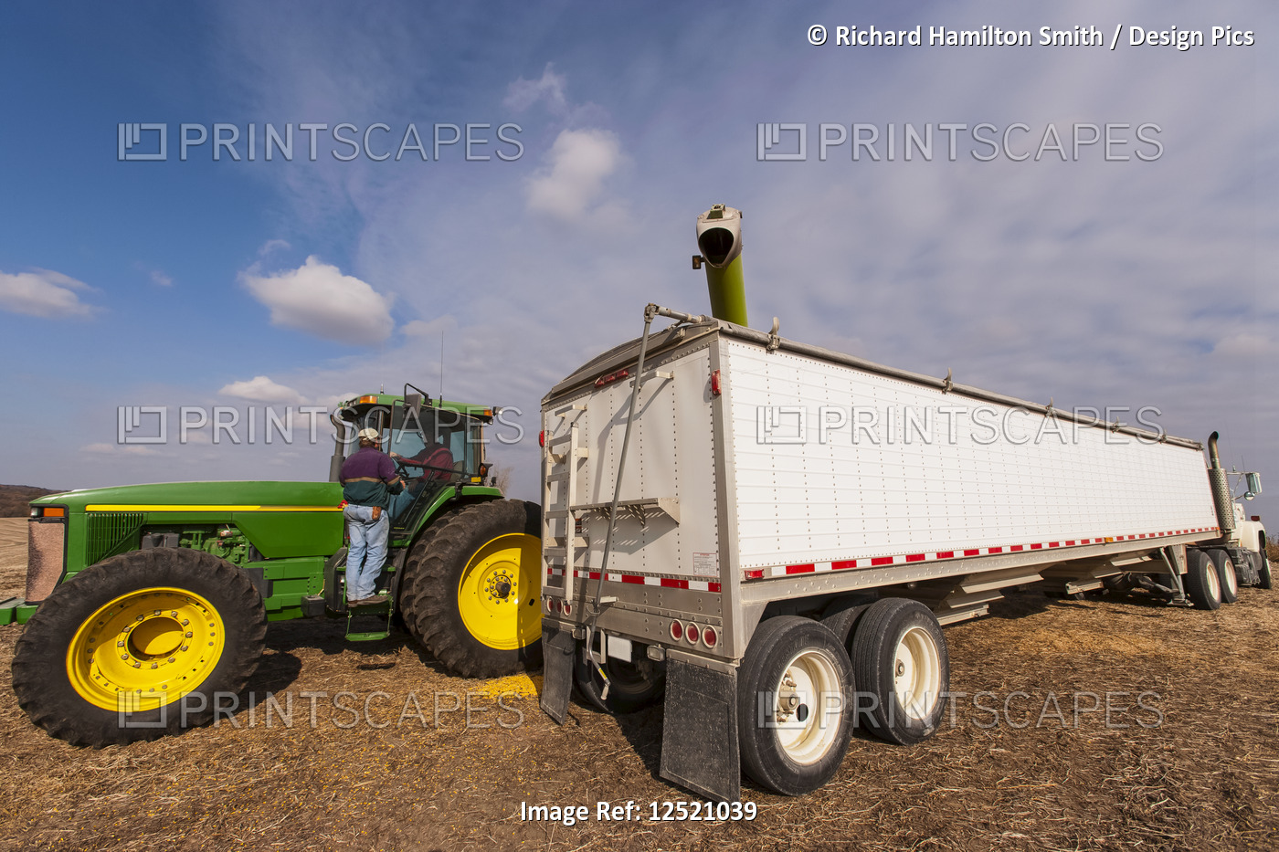 Two farmers discuss harvest during corn harvest, near Nerstrand; Minnesota, ...