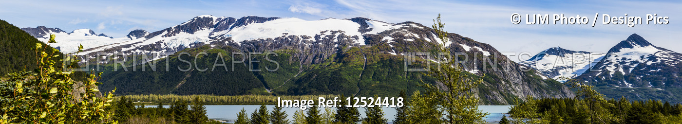 A panoramic view of the snow-covered Chugach Mountains and Portage Glacier near ...