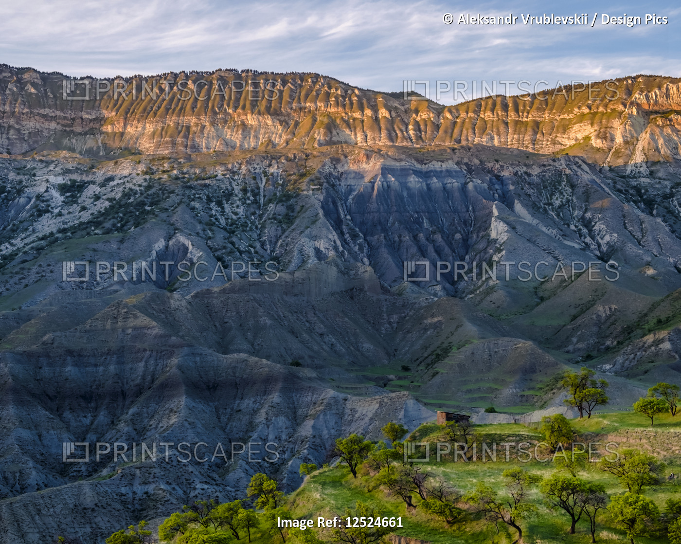 View of a small house on a ridge and the rugged landscape near the village of ...