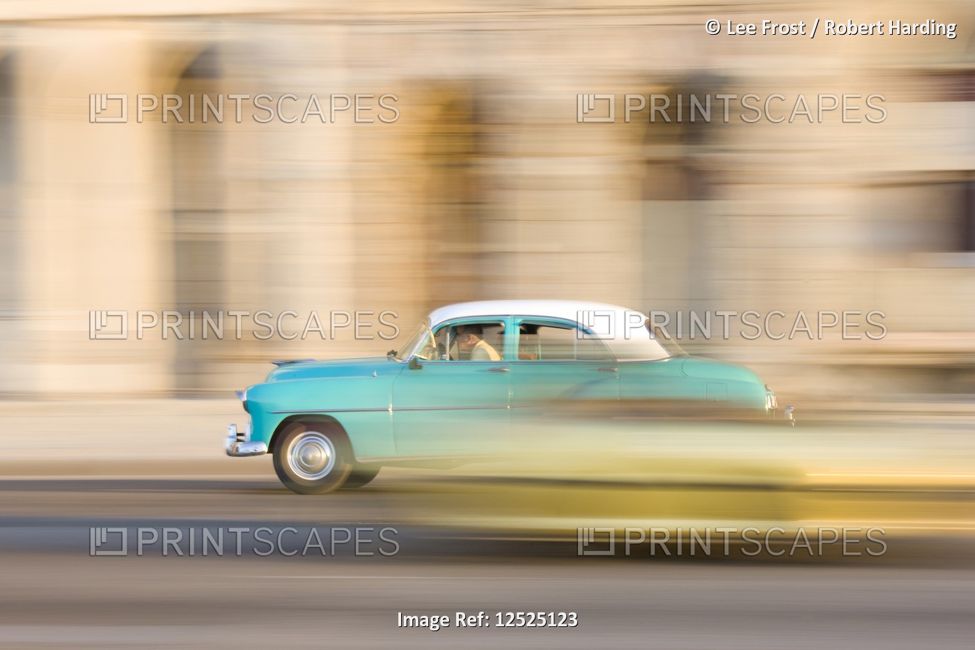 Panned shot of a classic American car on The Malecon, Havana, Cuba