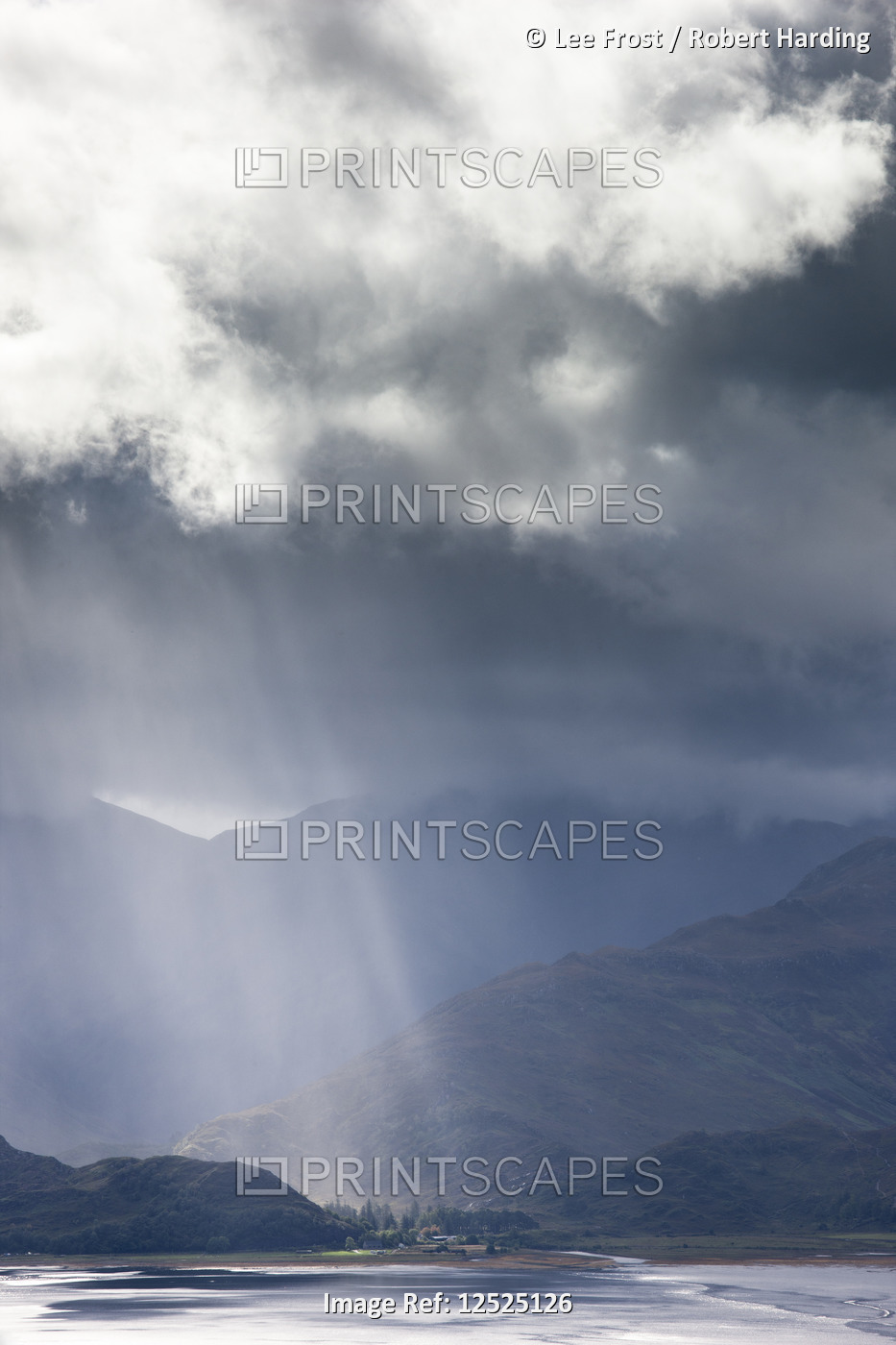 View from Carr Brae towards head of Loch Duich and Five Sisters of Kintail with sunlight bursting th