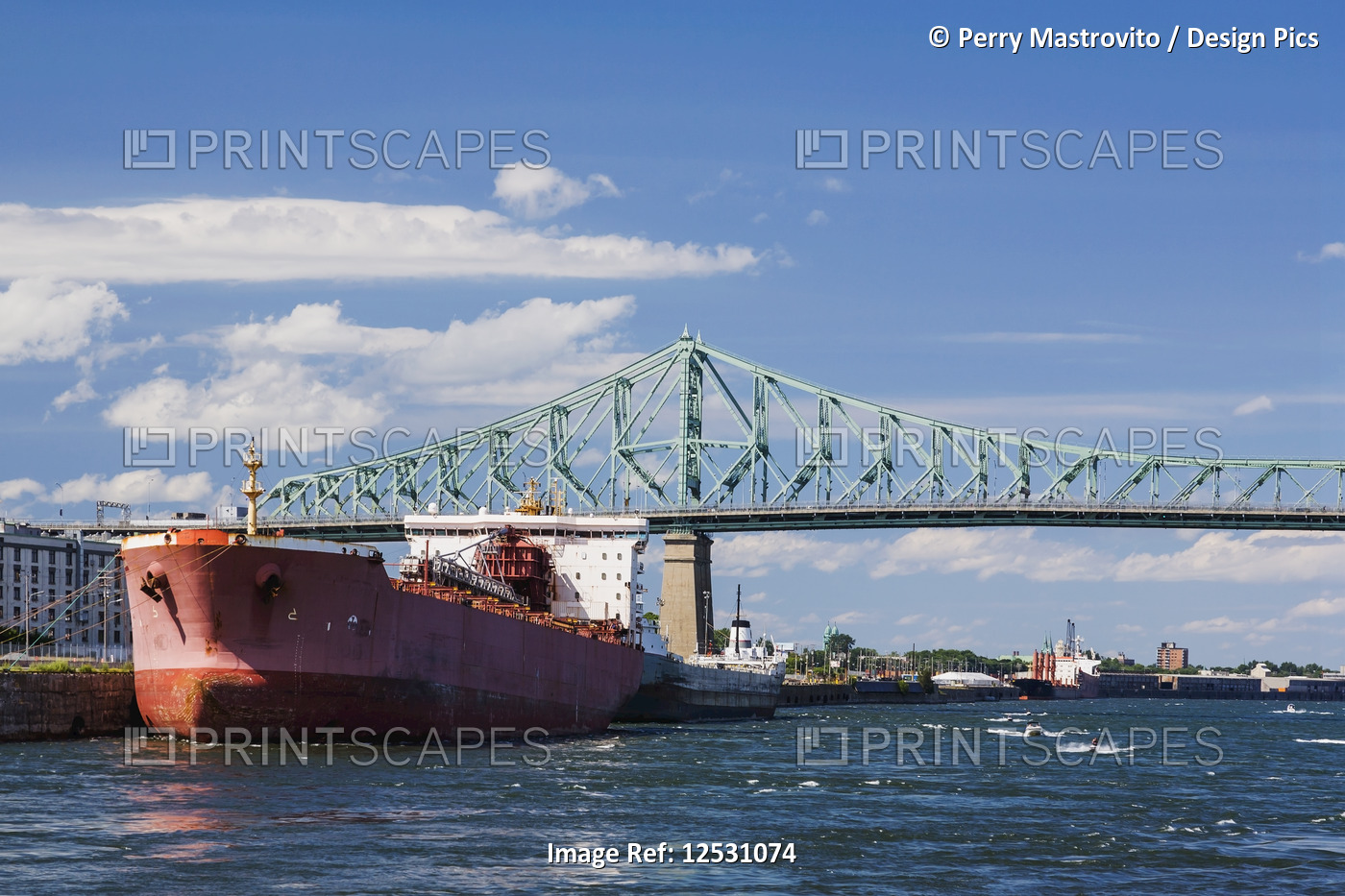 Moored Algoma Integrity cargo ship in port of Montreal and the Jacques Cartier ...