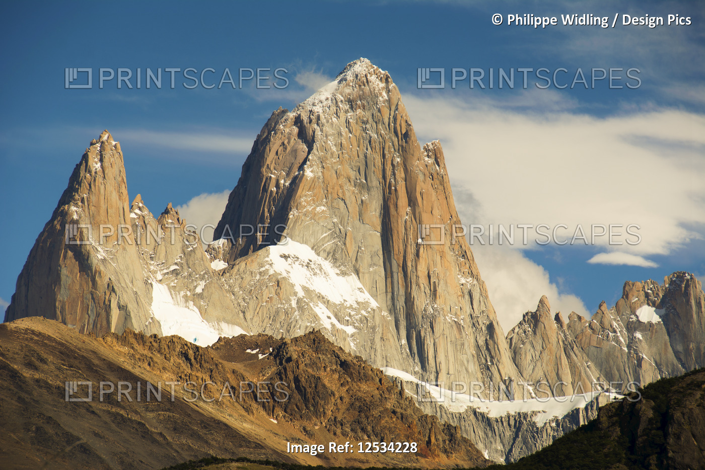 Close-up view of Mount Fitz Roy in the morning light against a blue sky with a ...