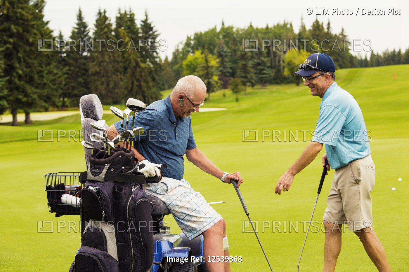 An able bodied golfer teams up with and assists a disabled golfer using a ...