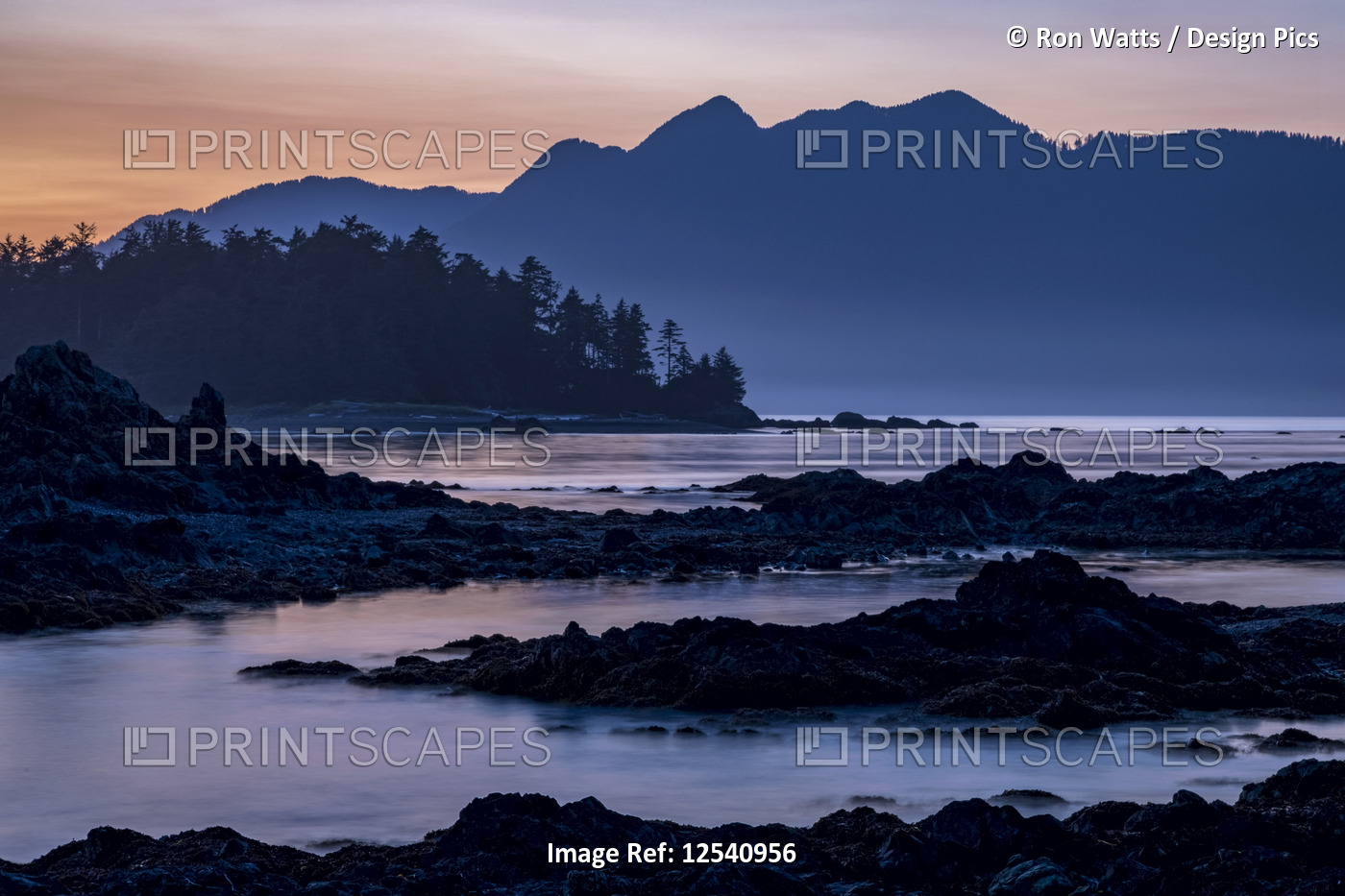 Dusk falls over Vancouver Island viewed from an islet in Nuchatlitz Provincial ...