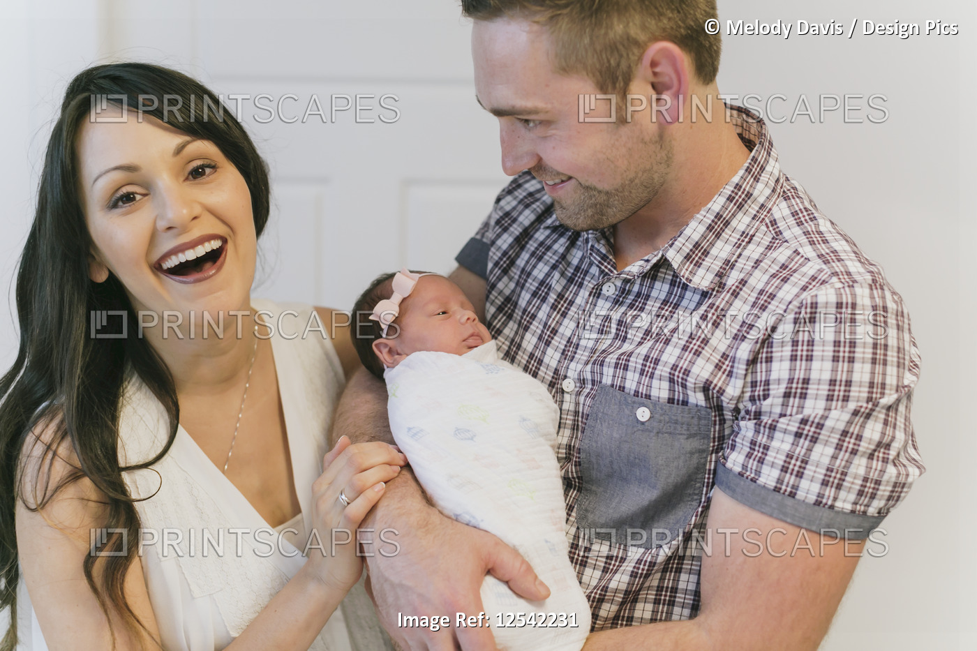 Portrait of a family with a newborn baby girl; Surrey, British Columbia, Canada
