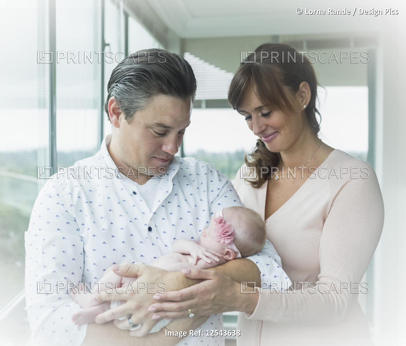 Portrait of a couple with their newborn baby; Surrey, British Columbia, Canada