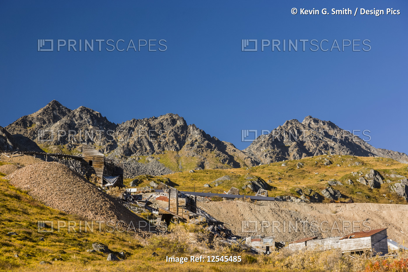 Dilapidated mine infrastructure of Gold Mint Mine in Hatcher Pass, blue sky in ...