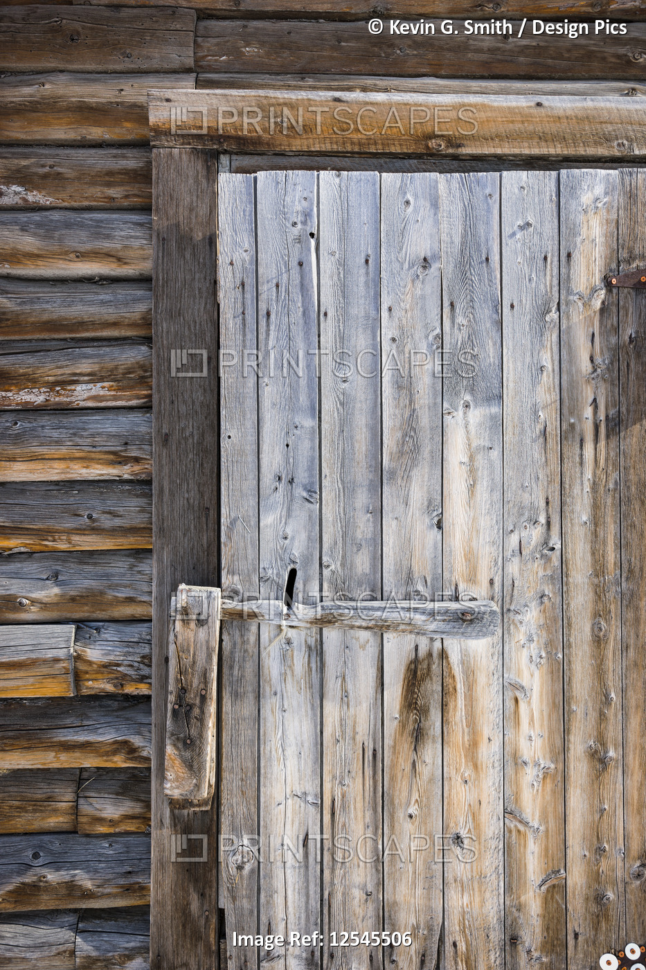 Detail of worn, weathered wooden door and latch, South-central Alaska; Palmer, ...