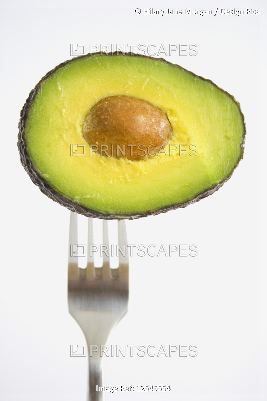 Half an avocado on fork