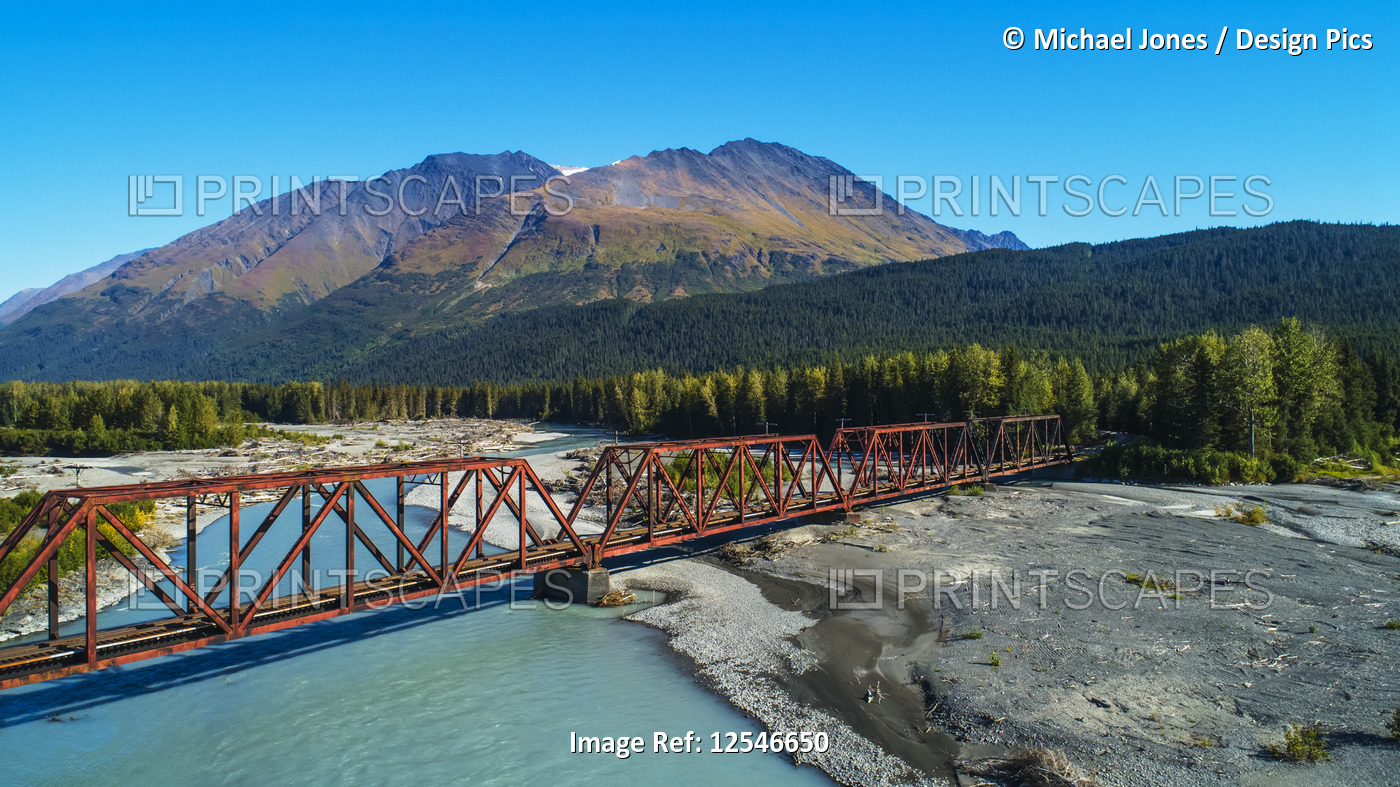 An aerial scenic of the Alaskan Railroad trestle crossing the Snow River on a ...