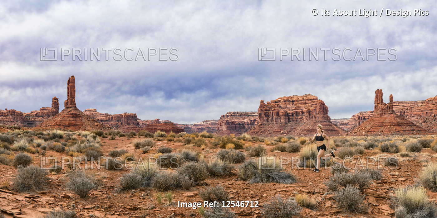 Jogger in the Valley of Gods with rock formations, panorama of stitched images; ...