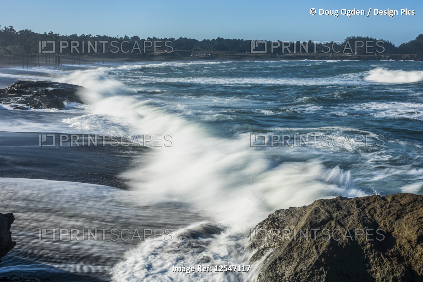 Waves softened by a long exposure surge onto the beach at MacKerricher State ...