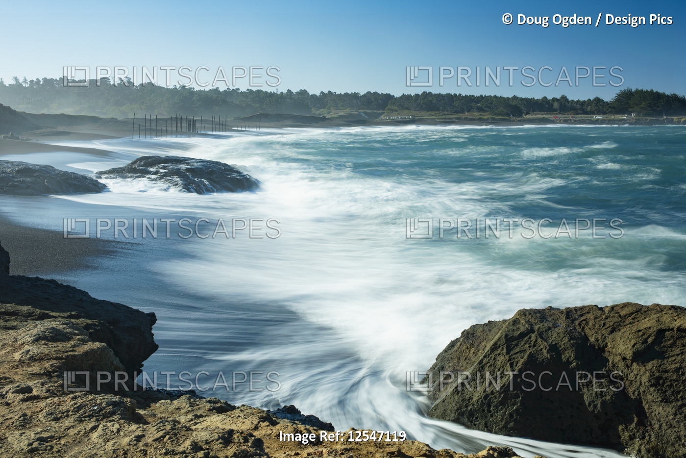 Waves softened by a long exposure surge onto the beach at MacKerricher State ...