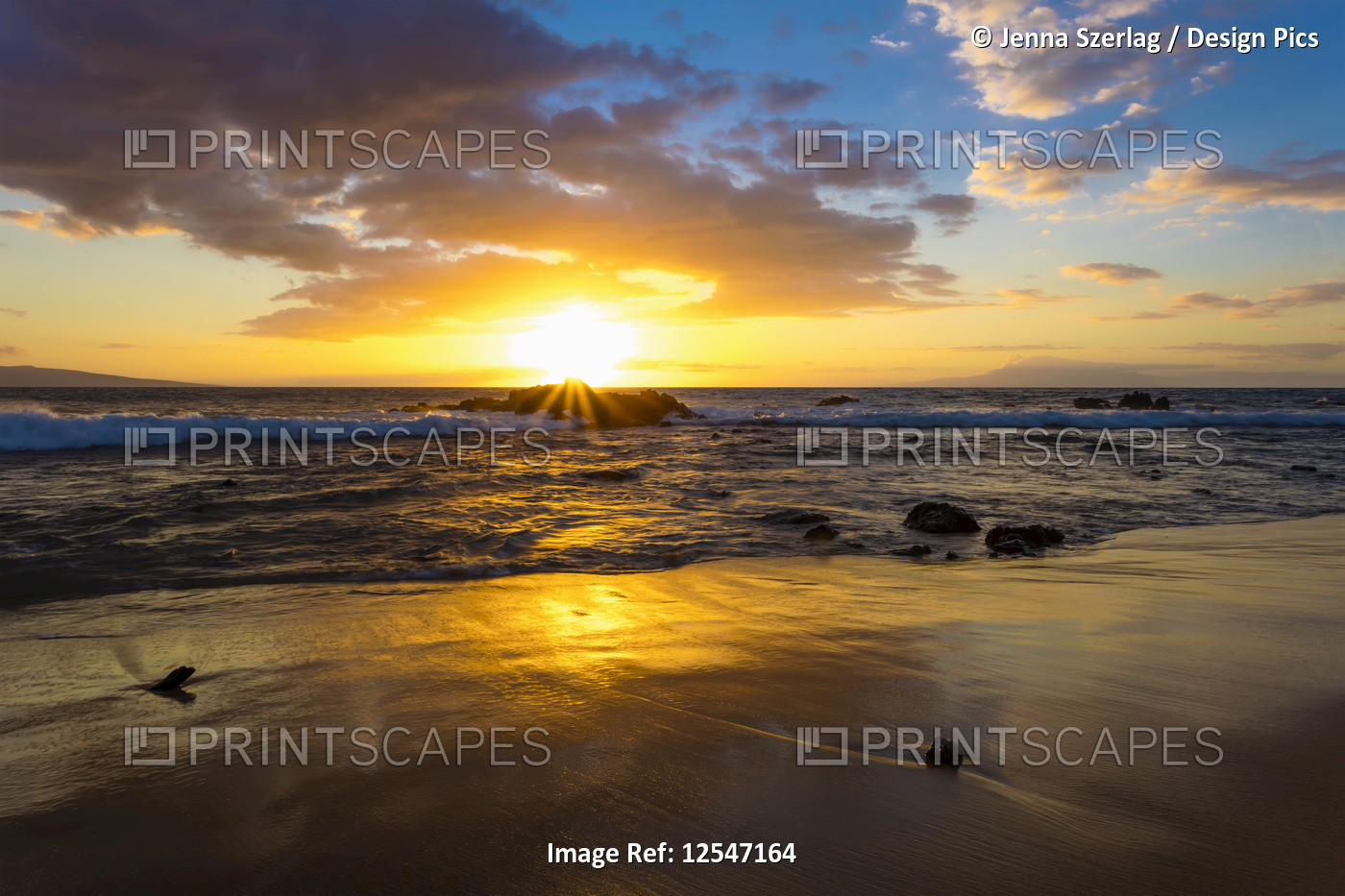 A Golden Sunset with Reflection On Sand at Ulua Beach, Wailea, Maui, Hawaii USA 