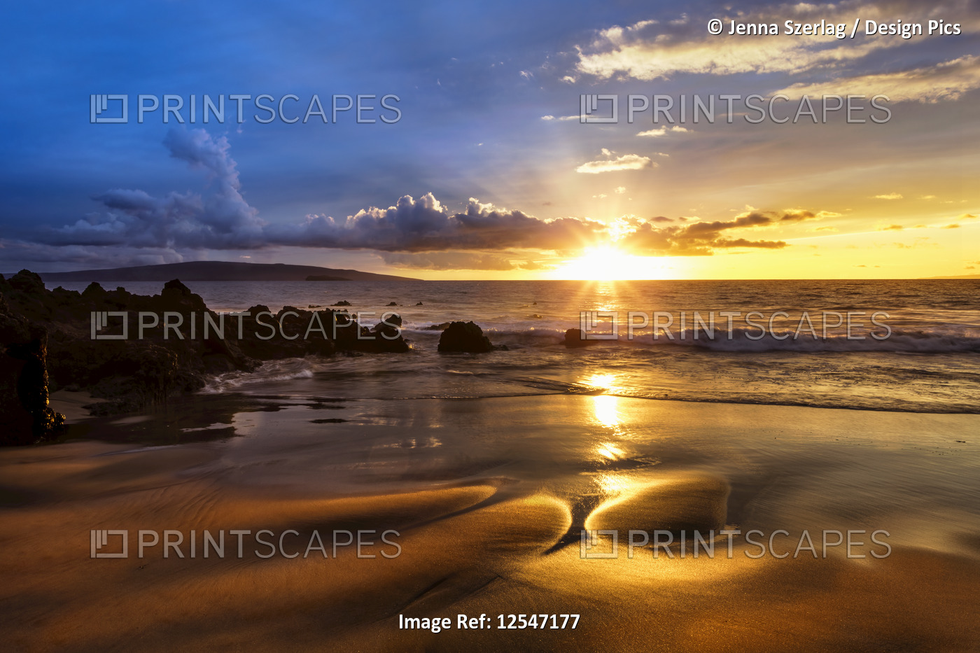 A Golden Sunset with Reflection On Sand At An Empty Makena Beach, Maui, Hawaii USA