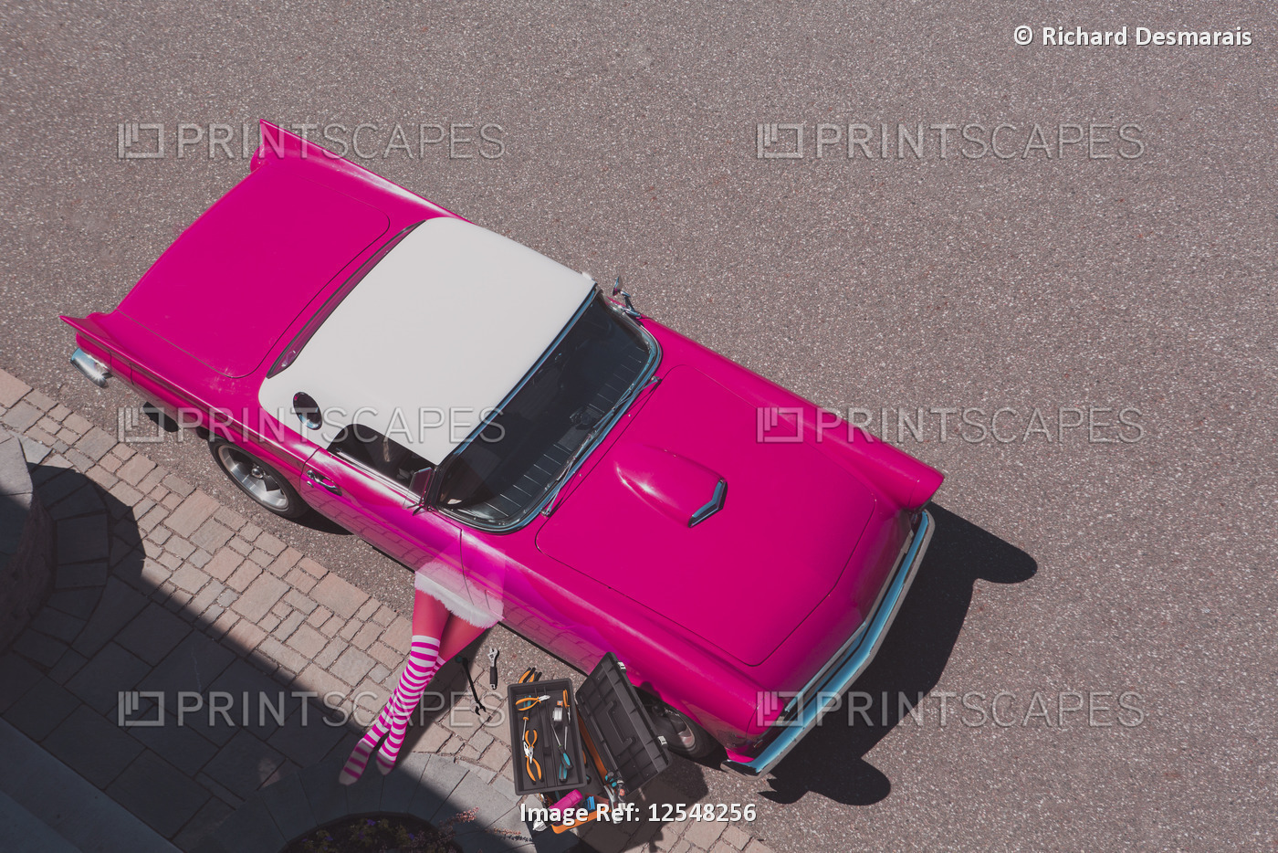A pink Thunderbird being repaired by a woman, composite image