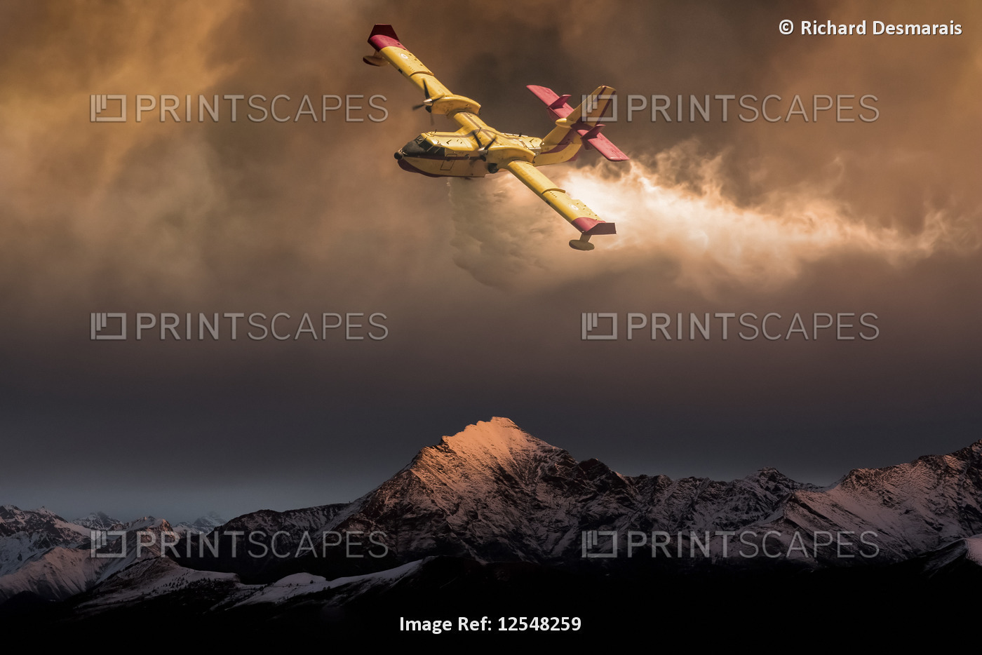 An aircraft dropping water on a forest fire in the mountains below, composite ...