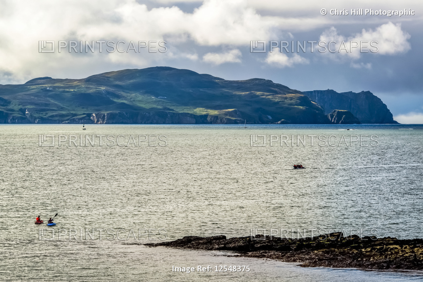 Kayaks and a boat in Sheephaven Bay; Downings, County Donegal, Ireland