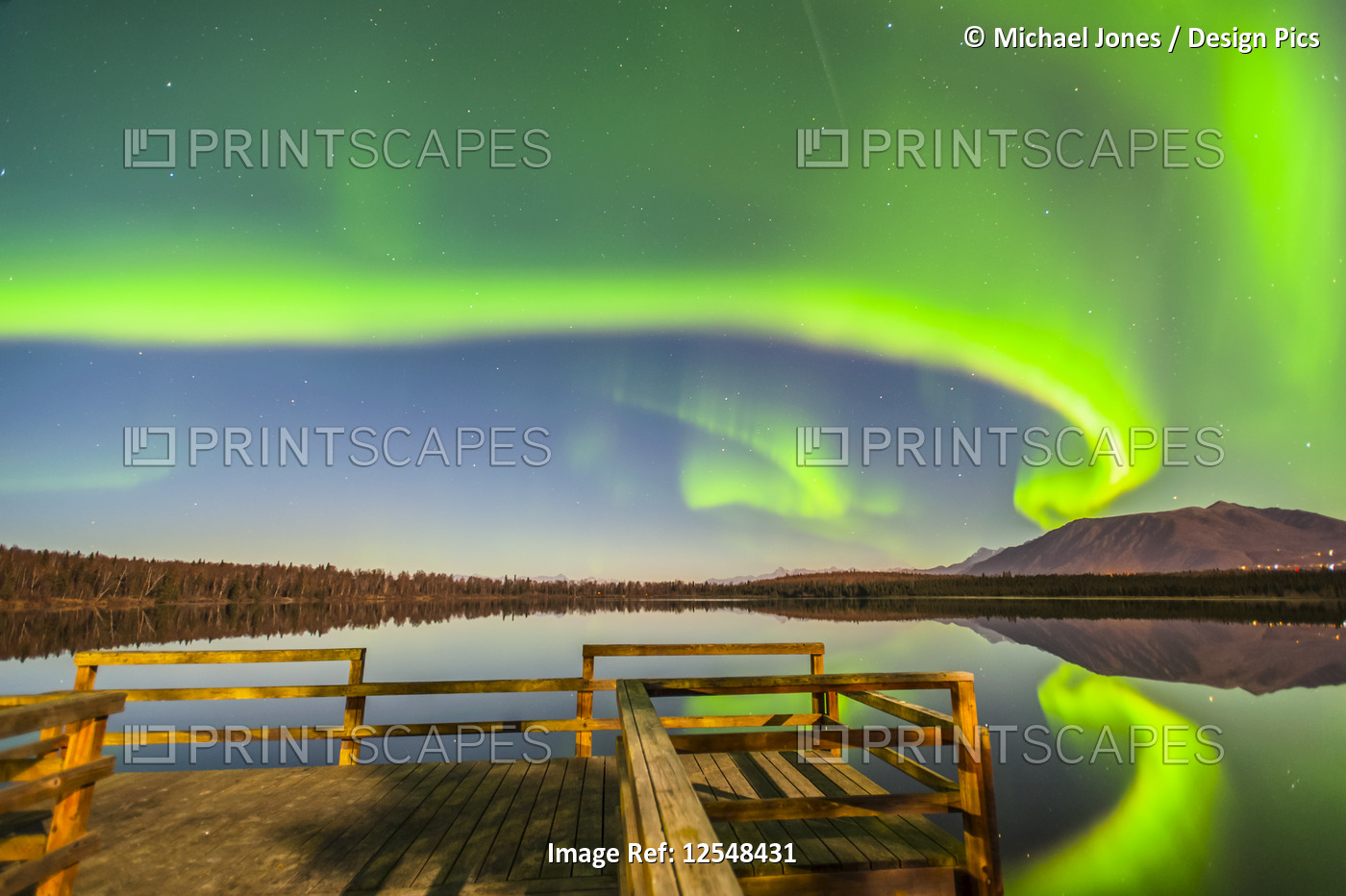 The Northern Lights are seen reflecting off Beach Lake on a clear, autumn night ...