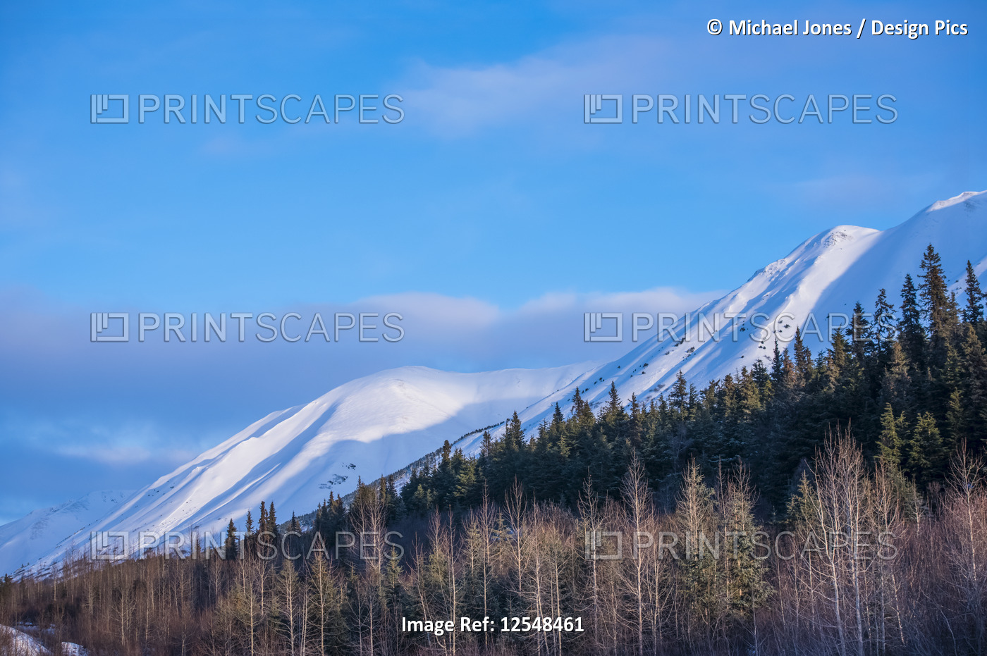 Clouds over mountain tops as daylight fades on the Chugach Mountains in ...