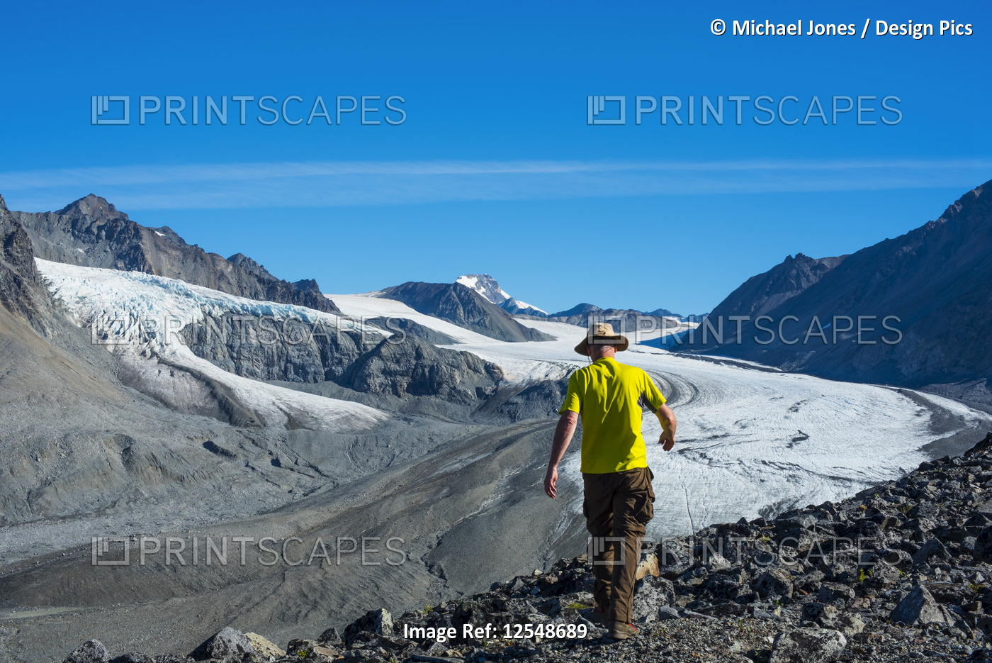 A man walks in Gulkana Glacier Valley in the Eastern Alaska Range in ...