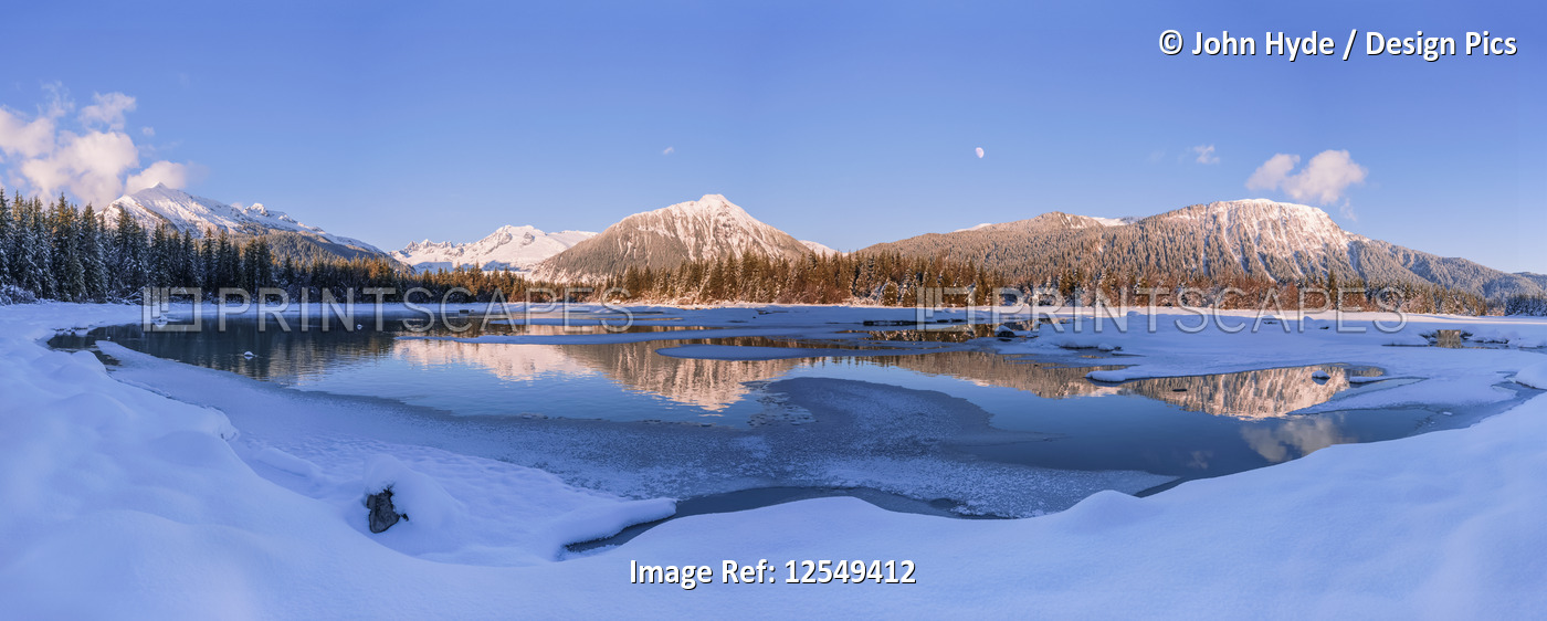 Lake and mountains in winter; Alaska, United States of America