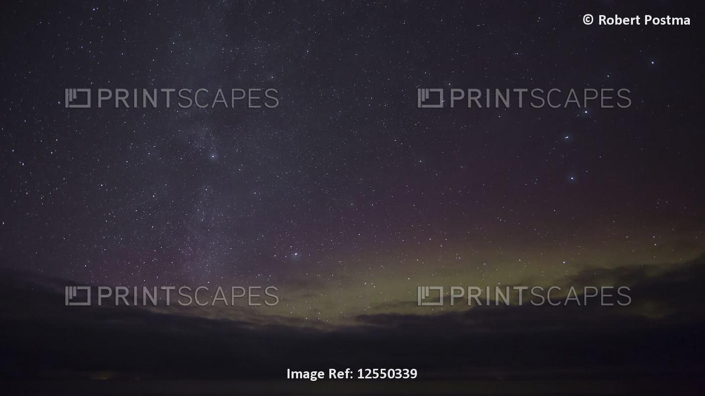 Northern Lights moving across the starry, night sky with a shooting star; ...