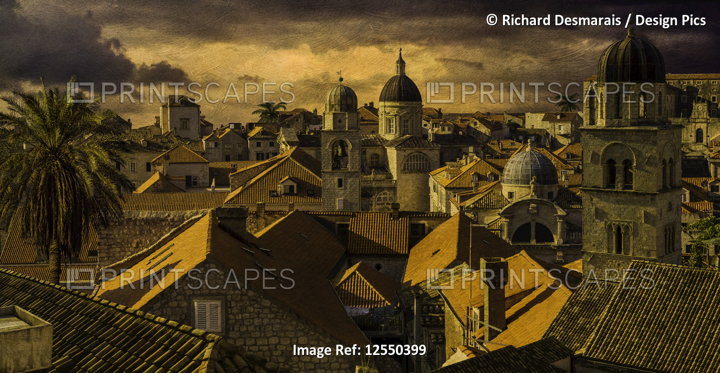 Skyline of Dubrovnik, Croatia at dusk with a view of rooftops and towers; ...