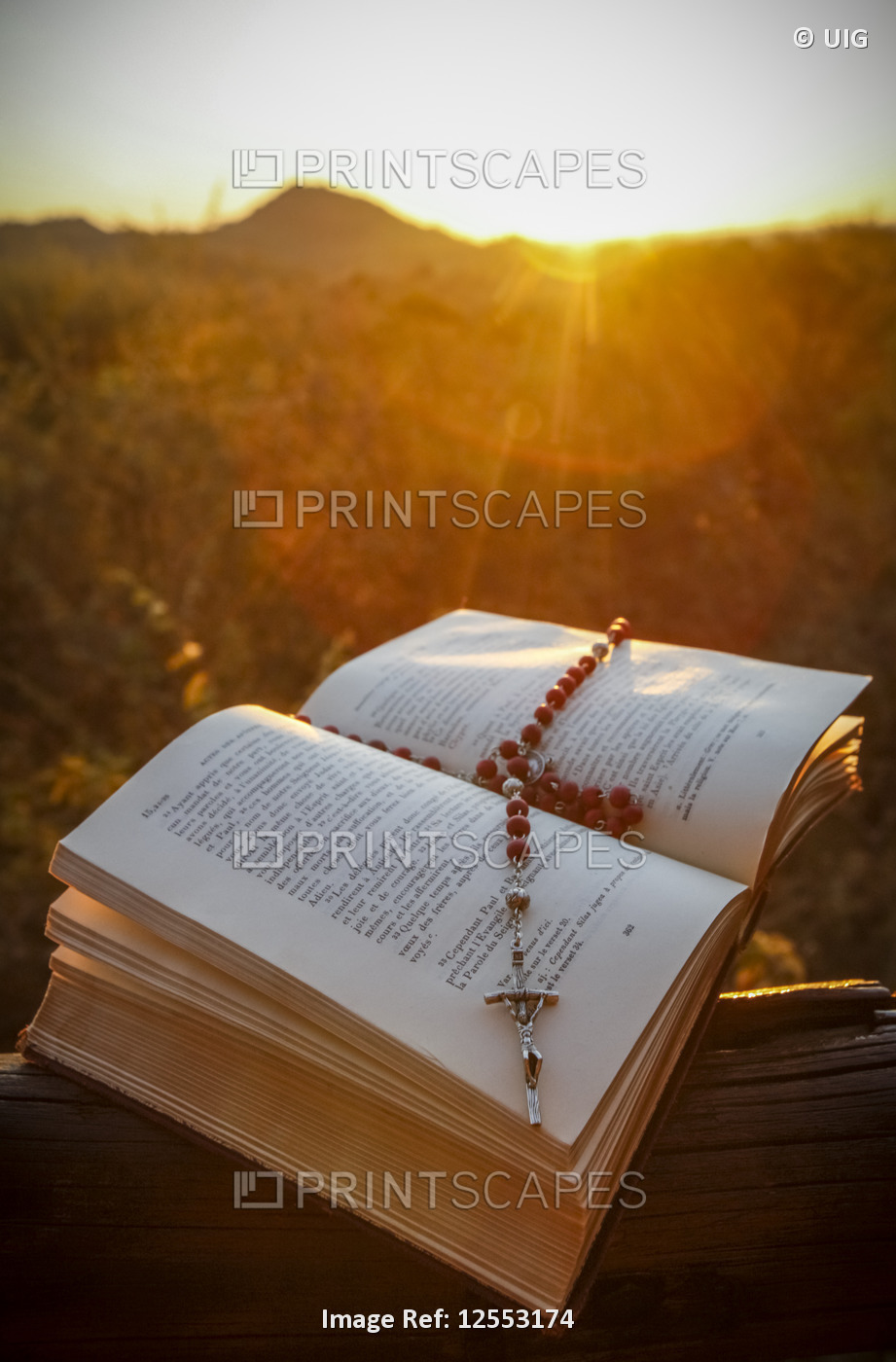 Open Bible and rosary